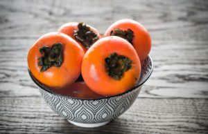 Bowl of fresh persimmons