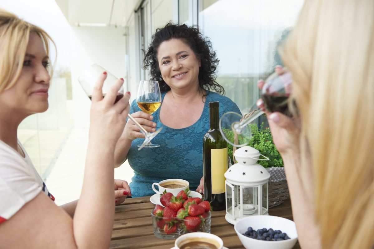 Mature woman drinking wine