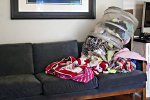 pile of laundry on the couch